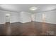Bright bonus room featuring hardwood floors, neutral walls and closet at 6112 Canyon Trl, Denver, NC 28037