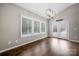 Bright dining area featuring shuttered windows and doors leading to the outside at 6112 Canyon Trl, Denver, NC 28037