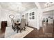 Elegant dining room with wainscoting, chandelier, and space to entertain dinner guests at 6112 Canyon Trl, Denver, NC 28037