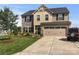 Charming two-story home featuring a well-manicured lawn and an attached two-car garage at 6112 Canyon Trl, Denver, NC 28037
