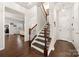 Classic staircase with hardwood floors and traditional banister at 6112 Canyon Trl, Denver, NC 28037