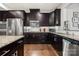 Well-equipped kitchen with stainless steel appliances, granite countertops, and ample cabinet space at 6112 Canyon Trl, Denver, NC 28037