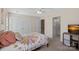 Bedroom features neutral walls, a patterned quilt, and access to an ensuite bathroom at 653 Camrose Ne Cir, Concord, NC 28025