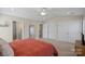 Bright bedroom with neutral walls and carpet, offering large closets and ensuite bathroom at 653 Camrose Ne Cir, Concord, NC 28025