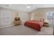 Spacious bedroom featuring natural light, a ceiling fan and a cozy atmosphere at 653 Camrose Ne Cir, Concord, NC 28025