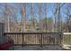 Outdoor deck with views of surrounding trees and possible distant building at 653 Camrose Ne Cir, Concord, NC 28025
