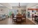 Dining area features a large table with seating for six and plenty of natural light at 653 Camrose Ne Cir, Concord, NC 28025