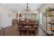 Elegant dining room with modern chandelier and seamless flow to the living room at 653 Camrose Ne Cir, Concord, NC 28025
