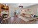 Cozy living room with fireplace, plush sofa, and door to the outdoor patio at 653 Camrose Ne Cir, Concord, NC 28025
