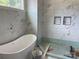 New bathroom showcasing tiled walls, a sleek, modern bathtub, and custom niches at 6855 Union Rd, Gastonia, NC 28056