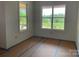 Well-lit room with large windows offering ample natural light, awaiting final touches at 6855 Union Rd, Gastonia, NC 28056