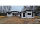New modern home with white siding, black trim, and a contemporary design at 6855 Union Rd, Gastonia, NC 28056