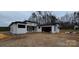 Modern home with white siding, black trim, and an attached garage, ready for move-in at 6855 Union Rd, Gastonia, NC 28056