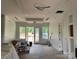 Open living area with decorative ceiling and modern lighting fixtures, awaiting final touches at 6855 Union Rd, Gastonia, NC 28056