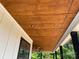 Inviting porch ceiling crafted with stained wood, complemented by recessed lighting and sleek ceiling fans at 6855 Union Rd, Gastonia, NC 28056