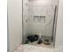 Modern shower area featuring marble-look tile walls and custom niche shelving at 6855 Union Rd, Gastonia, NC 28056