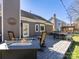 Backyard deck featuring outdoor seating, fire pit and home's exterior at 8413 Albury Walk Ln, Charlotte, NC 28277