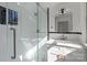 Modern bathroom featuring a glass shower with white subway tile and a vanity with sleek fixtures and a mirror at 85 Grove Nw Ave, Concord, NC 28025