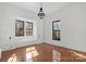 Bright bedroom with hardwood floors, large windows, and classic architectural details, creating a peaceful retreat at 85 Grove Nw Ave, Concord, NC 28025