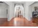 Spacious foyer with hardwood floors and a staircase, showcasing the home's classic architectural details at 85 Grove Nw Ave, Concord, NC 28025
