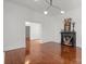 Spacious living room featuring hardwood floors, elegant fireplace, and neutral walls, ideal for comfortable living and entertaining at 85 Grove Nw Ave, Concord, NC 28025