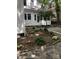 Charming home featuring a landscaped side yard with healthy ferns and lush greenery at 85 Grove Nw Ave, Concord, NC 28025