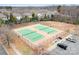 Aerial view of tennis courts and a parking lot, providing a recreational and parking perspective at 9223 Robbins Preserve Rd, Cornelius, NC 28031
