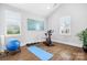 Versatile exercise room with large windows, hardwood floors, and fitness equipment for a healthy lifestyle at 9223 Robbins Preserve Rd, Cornelius, NC 28031