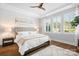 Bright main bedroom with large windows, hardwood floors, and neutral tones creating a cozy atmosphere at 9223 Robbins Preserve Rd, Cornelius, NC 28031