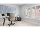 Office space featuring a desk, printer, and large painting, with windows providing natural light at 9223 Robbins Preserve Rd, Cornelius, NC 28031