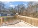 Wooden deck overlooking the backyard with mature trees at 1003 Harris St, Kannapolis, NC 28081