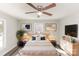Serene bedroom with a ceiling fan, soft lighting, and tasteful decor for a relaxing atmosphere at 1003 Harris St, Kannapolis, NC 28081