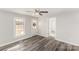 Bedroom featuring neutral walls, wood-look flooring, a ceiling fan, and natural light at 1003 Harris St, Kannapolis, NC 28081