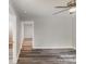 Large empty room with wood-look floors and doorways, ready for customization at 1003 Harris St, Kannapolis, NC 28081