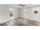 A bright empty room showcasing natural light and wood-look floors with a neutral paint at 1003 Harris St, Kannapolis, NC 28081