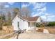 Exterior view of a charming home with a wood deck and gravel driveway at 1003 Harris St, Kannapolis, NC 28081