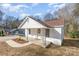 Charming single-story home featuring a covered front porch and manicured landscaping at 1003 Harris St, Kannapolis, NC 28081
