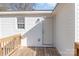 Welcoming back porch featuring a wooden deck and a bright white exterior with complementing trim and an exterior door at 1003 Harris St, Kannapolis, NC 28081