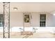 Charming front porch with decorative wreath and a 