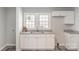 Bright and functional kitchen with white cabinets and granite countertops at 1003 Harris St, Kannapolis, NC 28081