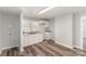 A clean laundry room with white cabinets, granite countertops, and utility connections at 1003 Harris St, Kannapolis, NC 28081