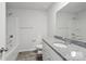 The bathroom features a vanity with a granite countertop, a large mirror, and tub shower combo at 1211 Pine St # A, Mooresville, NC 28115