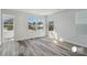 Bright bedroom featuring hard surface flooring, large windows that provide natural light, and neutral paint at 1211 Pine St # A, Mooresville, NC 28115