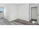 Neutral bedroom features hard surface floors, a neutral wall color, and a large walk in closet at 1211 Pine St # A, Mooresville, NC 28115
