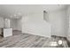 Open-concept living room boasts hard surface floors, neutral walls and an open staircase at 1211 Pine St # A, Mooresville, NC 28115