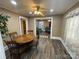 Inviting dining room with ceiling fan, hardwood floors and natural light at 122 E Hargrave St # 50, Wadesboro, NC 28170