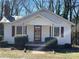 Charming one-story home featuring a classic design, inviting front porch and a neatly landscaped front yard at 122 E Hargrave St # 50, Wadesboro, NC 28170
