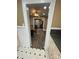 View of the living room through an archway, showing new laminate flooring and an open concept layout at 122 E Hargrave St # 50, Wadesboro, NC 28170