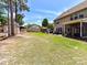 Spacious backyard featuring a shed, raised garden beds, patio, and lush green lawn at 16404 Mckee Ridge Dr, Charlotte, NC 28278