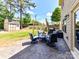 Spacious backyard with a stone patio, comfortable seating, and a well-maintained lawn for outdoor enjoyment at 16404 Mckee Ridge Dr, Charlotte, NC 28278